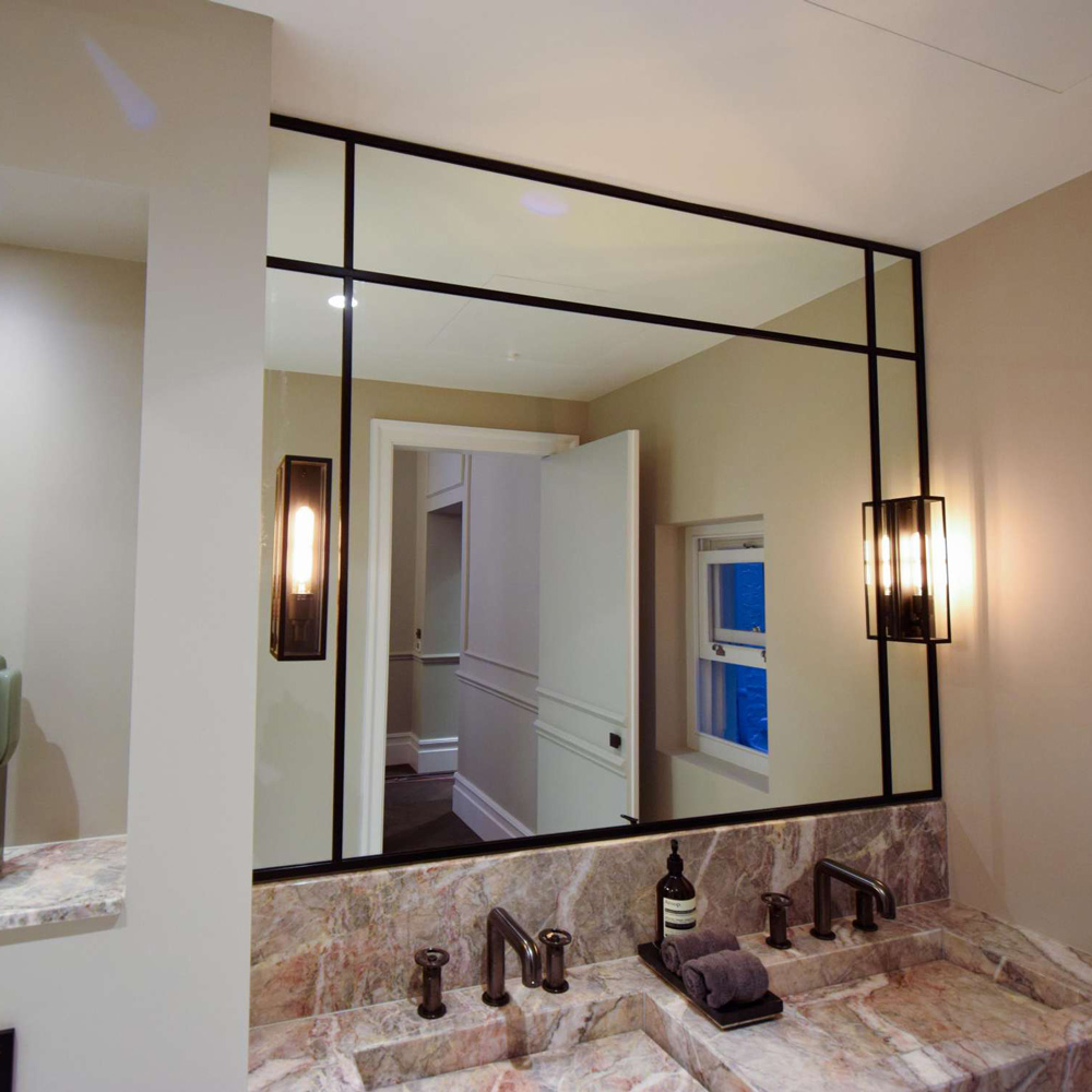 mirror with a black frame in an industrial style